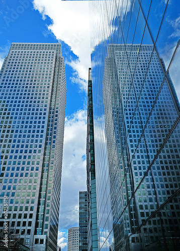 Reflection of a skyscraper on another skyscraper s windows nearby.