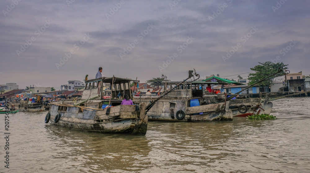 Can Tho, Vietnam - January 14, 2018: Sunrise with boats on the Can Tho floating market river, Mekong Delta, Vietnam