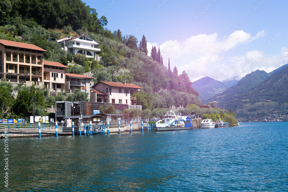Public waterway shuttle and architecture on the island of Monte Isola, Lake Iseo, Italy Public waterway shuttle and architecture on the island of Monte Isola, Lake Iseo, Italy