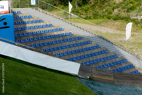 Wisla, Poland, 24 May 2018: Chairs in the place for spectators at the ski jump named Adam Malysz in Wisla Malinka photo