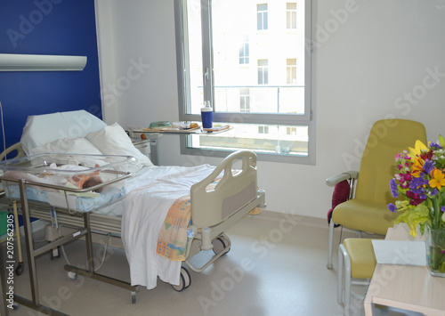 Empty hospital bed and newborn baby near the bed © o1559kip