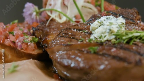 delicious appetizing pork steak cooked on a grill close-up with cheese and bread with adjika. Caucasian cuisine, rotation. photo