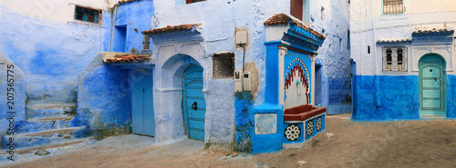 Pretty typical street in the medina of Chefchaouen, one of the most touristic towns of Morocco © juanorihuela