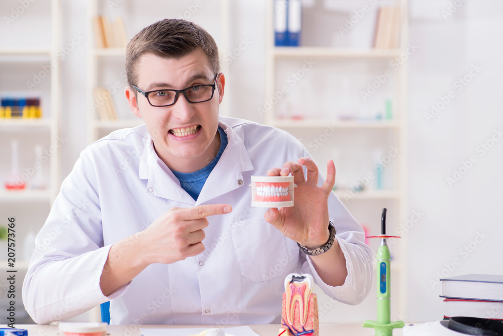 Dentist working teeth implant in medical lab Dentist working teeth implant in medical lab