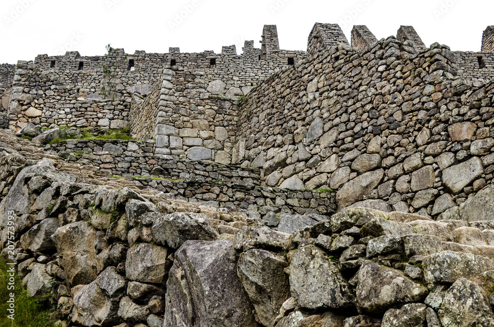 Stone built terracing and buildings at Machu Picchu, an ancient Inca archaeological site near Cusco, Peru