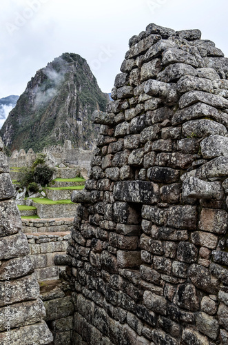 Stone built terracing and buildings at Machu Picchu, an ancient Inca archaeological site near Cusco, Peru