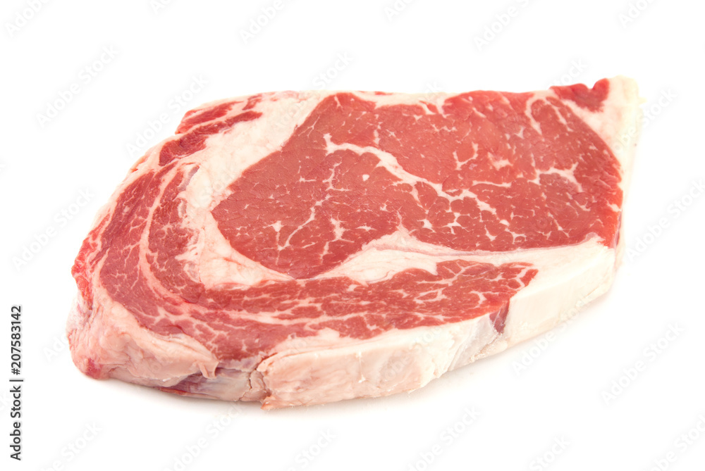 Raw Rib Eye Steak on a White Background Raw Rib Eye Steak on a White Background