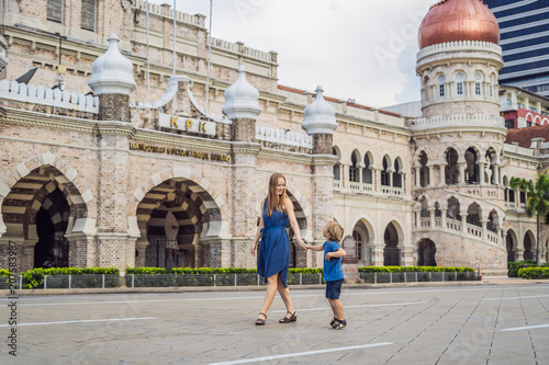 Photography Mom and son on background of Sultan Abdul Samad Building in Kuala Lumpur, Malaysia