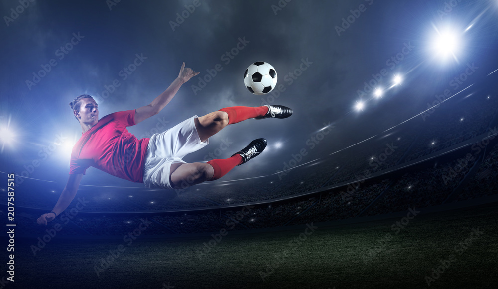 Fototapeta premium Soccer player in action on stadium background.