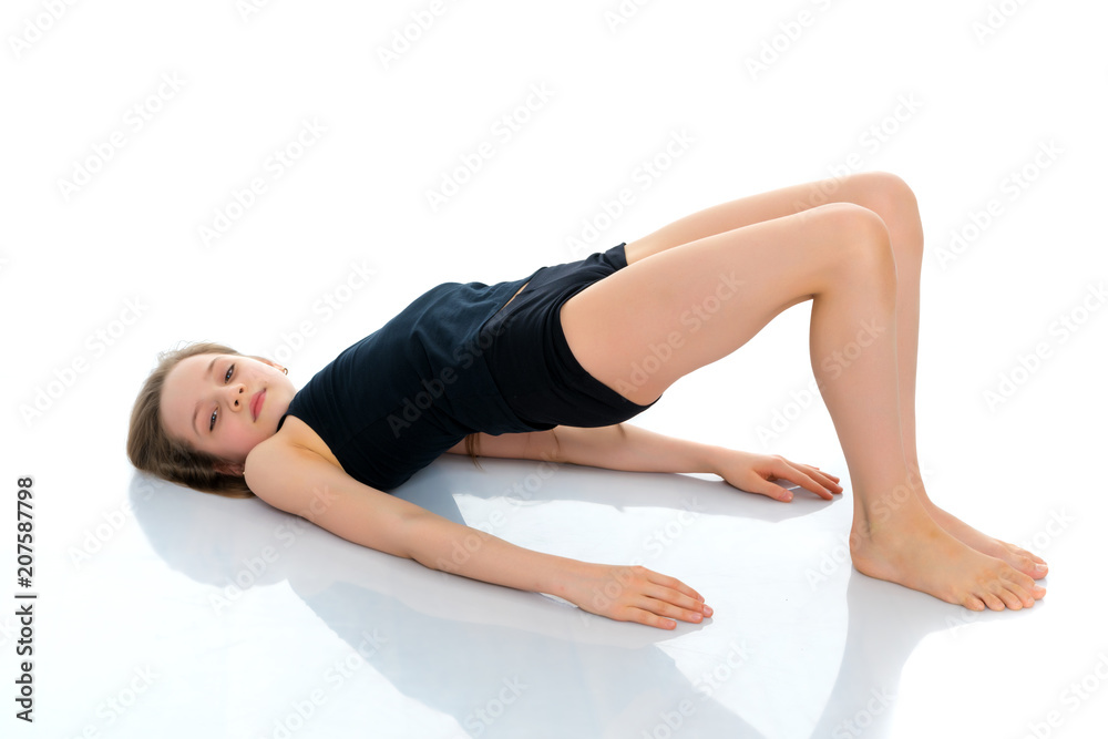 The gymnast perform an acrobatic element on the floor. The gymnast perform an acrobatic element on the floor.