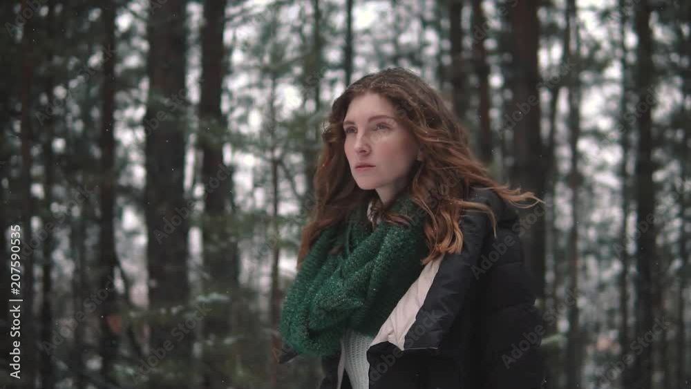 portrait of a strange and mysterious red-haired girl in a winter forest portrait of a strange and mysterious red-haired girl in a winter forest
