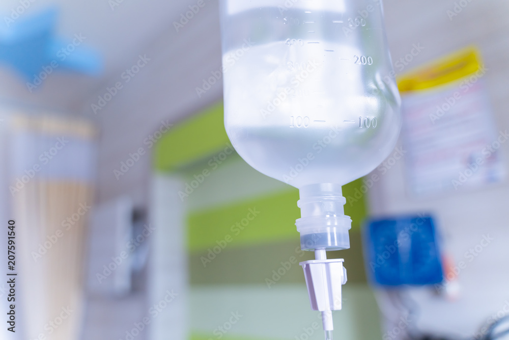 Close up saline solution drip for patient and infusion pump in hospital, Treatment of the disease of the doctor concept.
