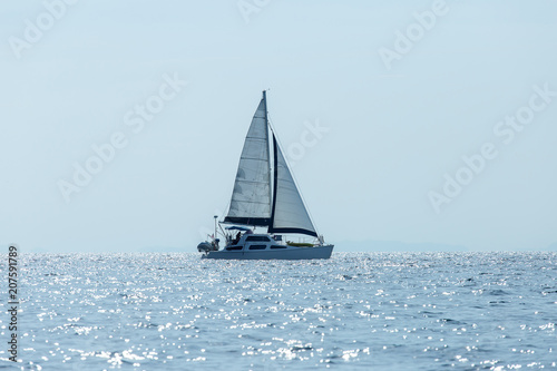 Sailing ship luxury yacht with white sails in the Sea.