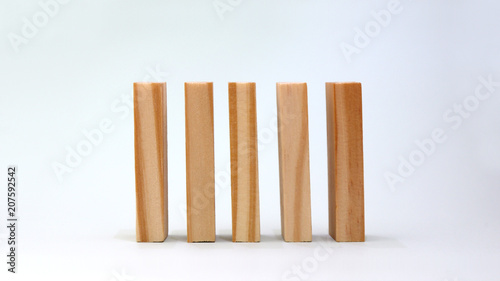 Five wooden blocks lined up.