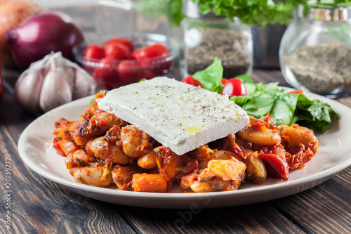 Baked giant beans with feta cheese photo
