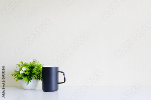 Workspace with coffee cup and tree decoration