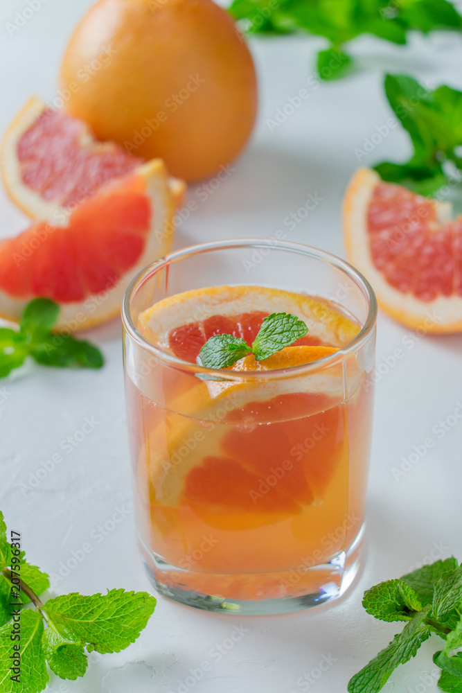 Grapefruit water in a glass with mint