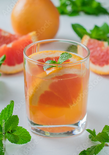 Honey mint grapefruit water in a glass