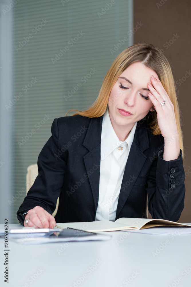 dull boring work. depressed sad business woman sitting in office working with papers dull boring work. depressed sad business woman sitting in office working with papers