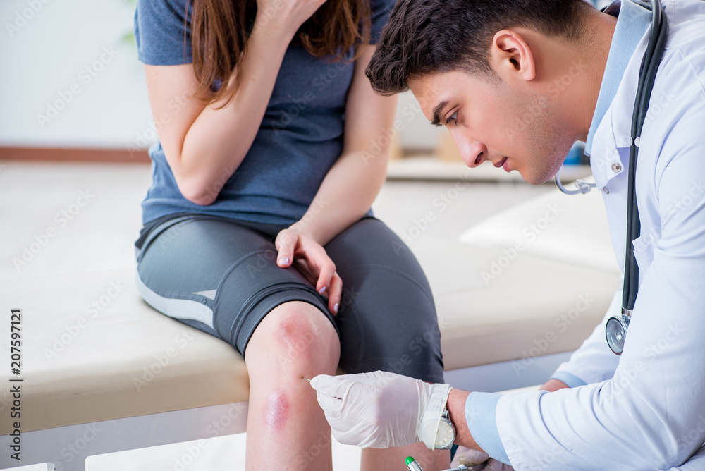 Patient visiting doctor after sustaining sports injury Patient visiting doctor after sustaining sports injury