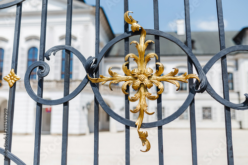 ornate iron and gold elements of gate decoration photo