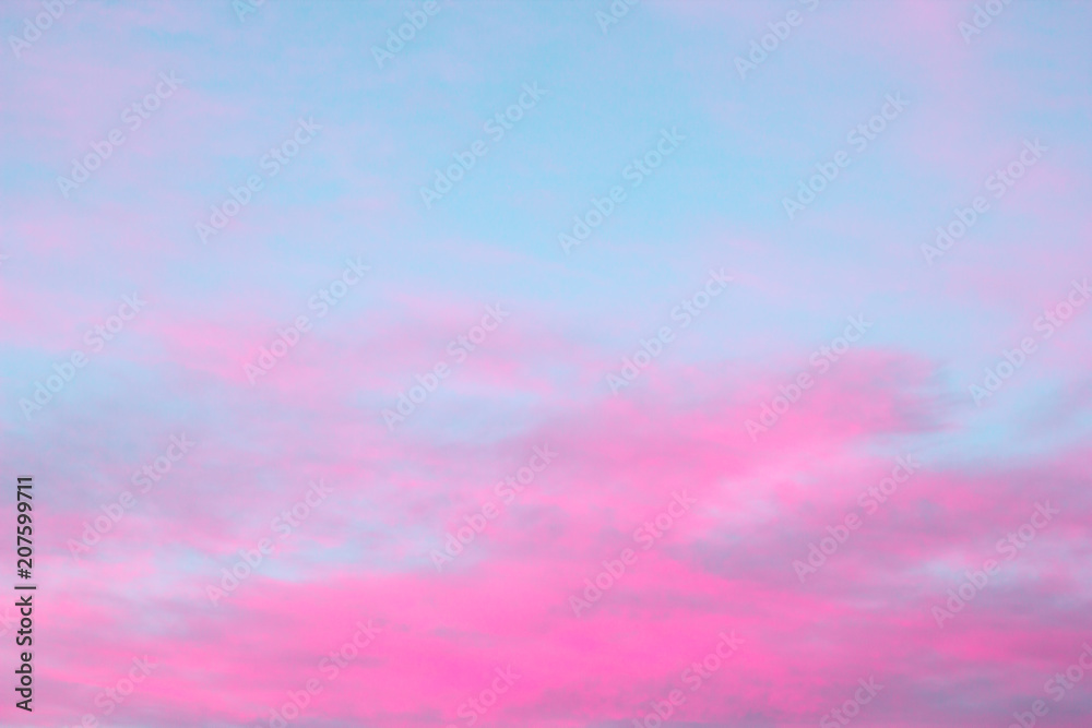 bright pink clouds on a blue sky at the sunset