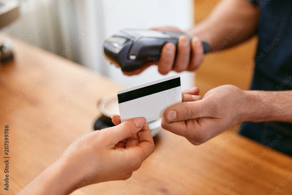 Customer Paying With Credit Card In Coffee Shop Closeup Customer Paying With Credit Card In Coffee Shop Closeup