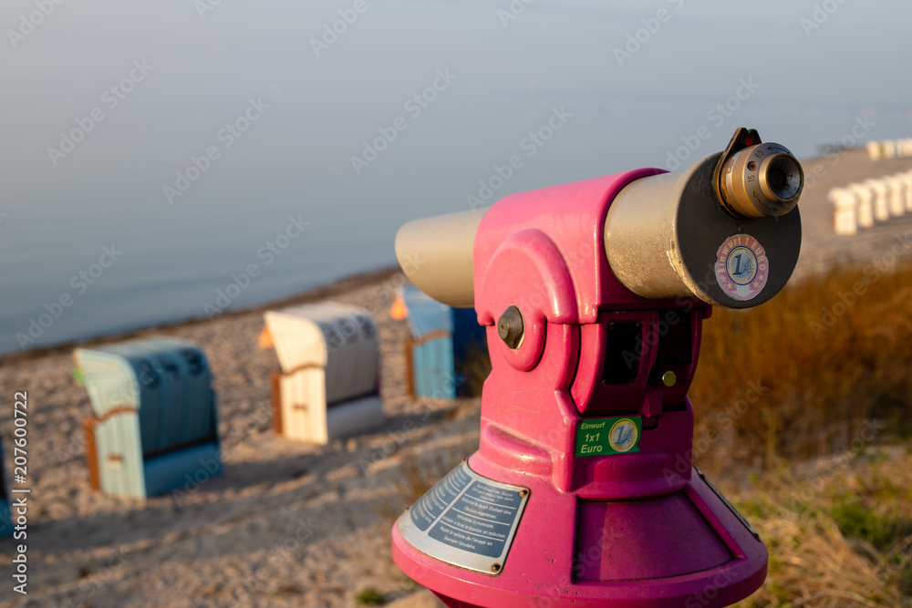 pay telescope at baltic sea beach