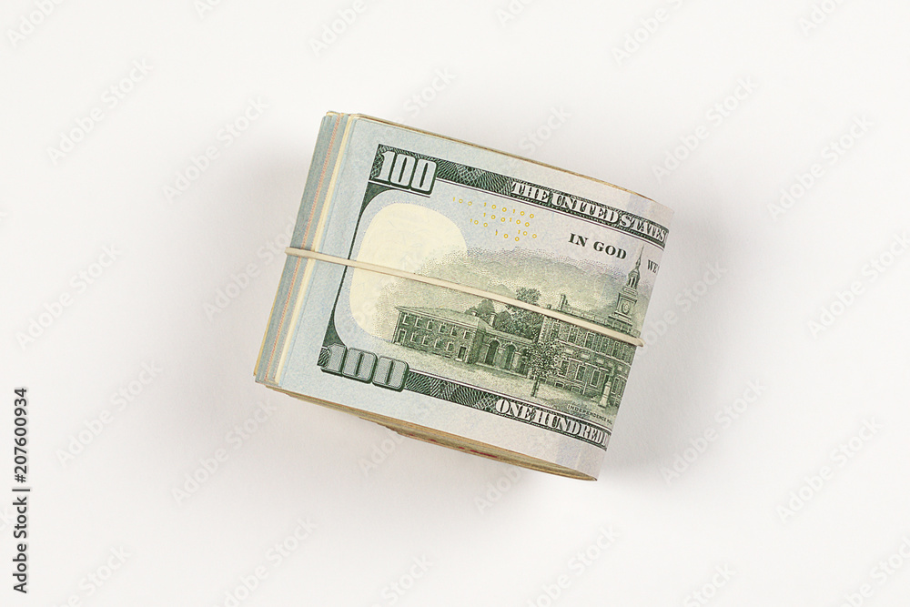 100 dollar bill roll isolated on white background. 100 dollar bill roll isolated on white background.