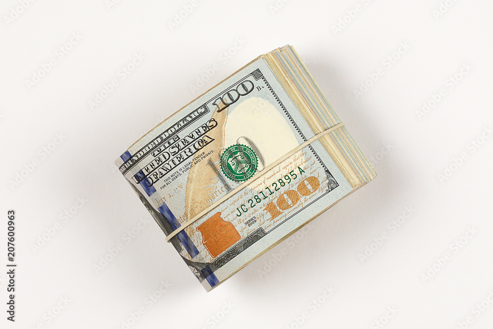 100 dollar bill roll isolated on white background. 100 dollar bill roll isolated on white background.
