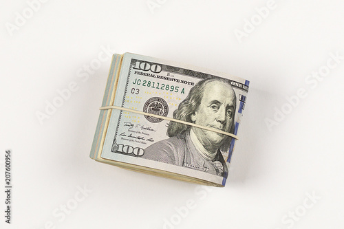 100 dollar bill roll isolated on white background.