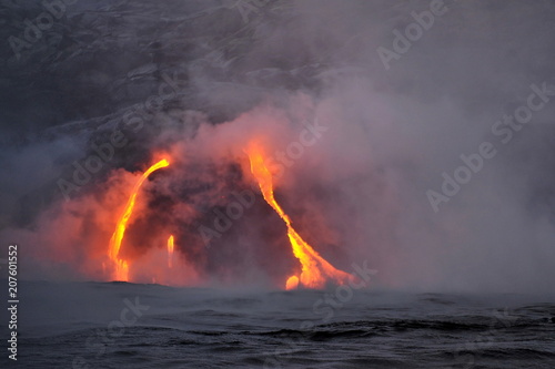 The lava of Kilauea volcano flows into the Pacific Ocean