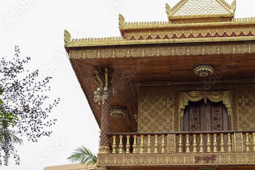 Buddhist architecture in Wat Damnak pagoda, Siem Reap, Cambodia. Traditional khmer relief on wall. photo