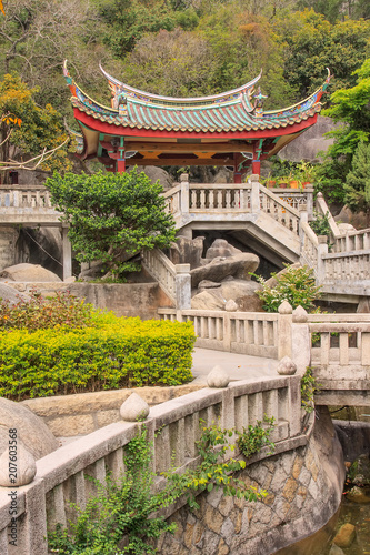 Stairs to pavilion against mountain ridge at Buddhist Temple, Xiamen, China