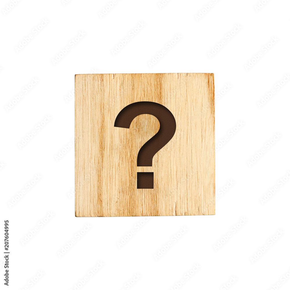 The question mark of the alphabet on a wooden cube. The question mark of the alphabet on a wooden cube.