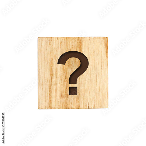 The question mark of the alphabet on a wooden cube.