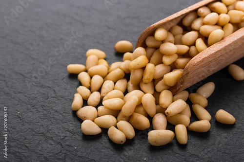 peeled pine nuts on a rustic background