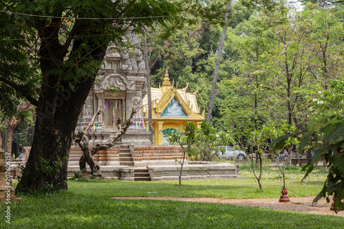 Buddhist architecture in Wat Damnak pagoda, Siem Reap, Cambodia. Traditional khmer pagoda in old park. photo