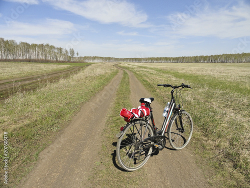 Traveling by bike through fields and forests