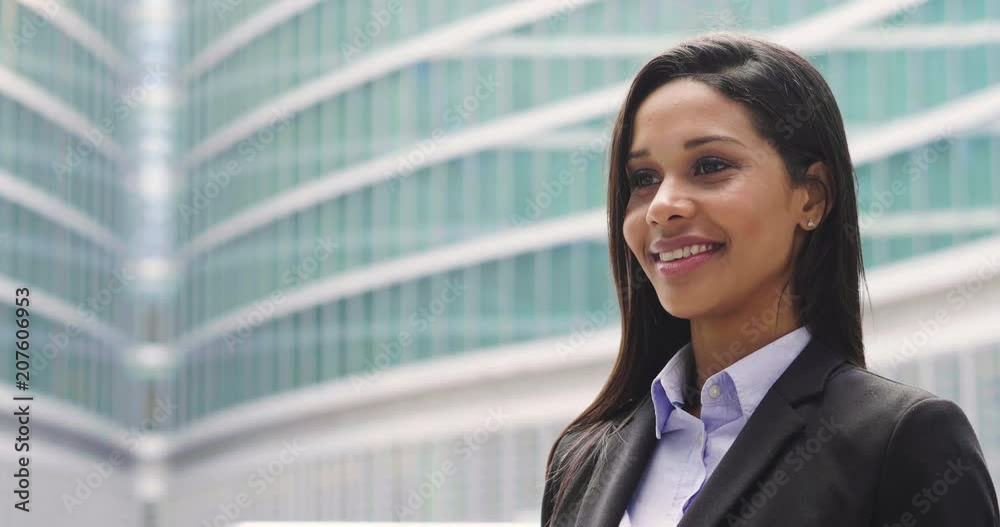 Portrait of a business woman, in a suit and tie, happy and smiling as she looks at the camera and crosses her arms, proud of her work. Concept of: success, finance and female career Portrait of a business woman, in a suit and tie, happy and smiling as she looks at the camera and crosses her arms, proud of her work. Concept of: success, finance and female career