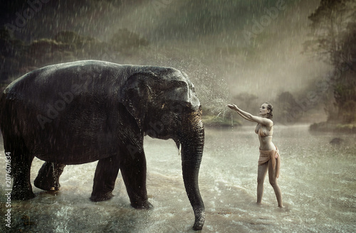 Sensual lady taming an indina elephant