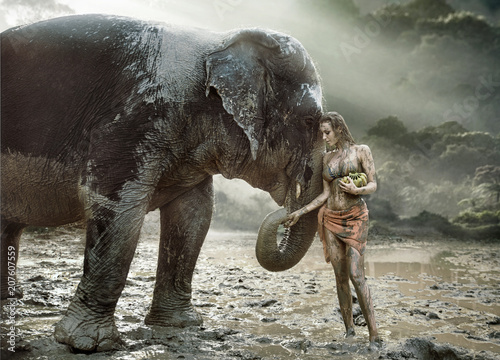 Sensual tamer feeding her elephant pet