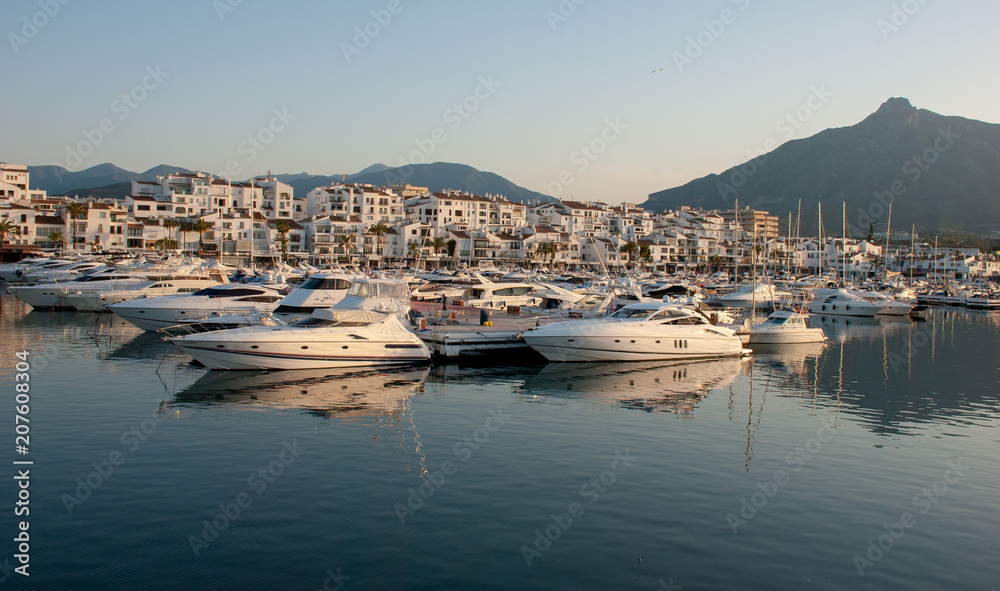 Porto Banus marina,  Playground of the rich and famous  Super yachts moored. May 2018.