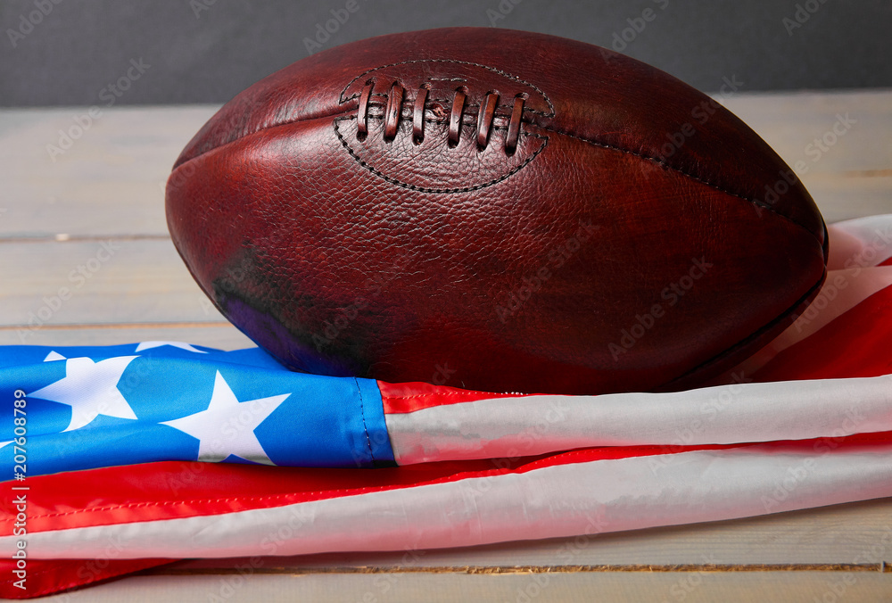 Obraz premium American football ball and old glory flag..
