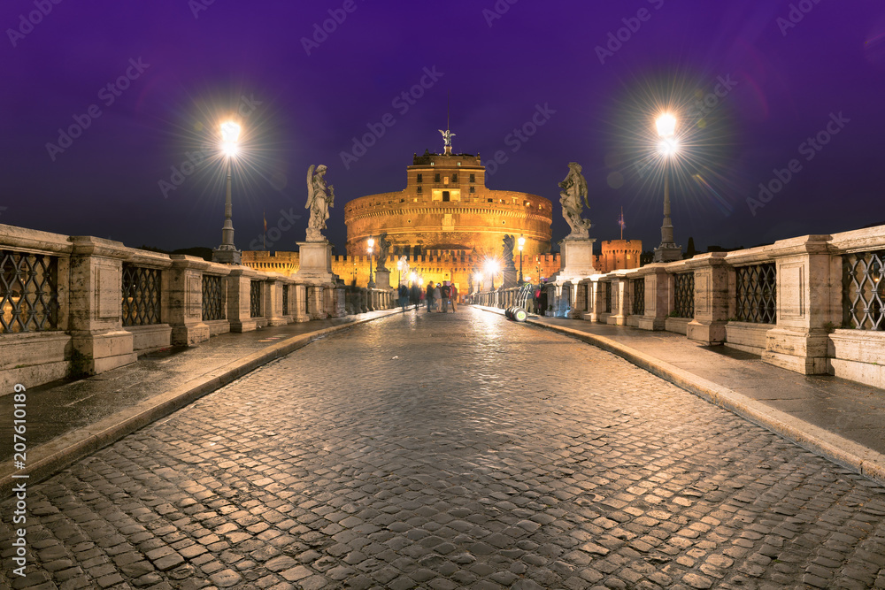 Night view of Saint Angel Castle and bridge over the Tiber river in Rome, Italy. Night cityscape of Rome.  