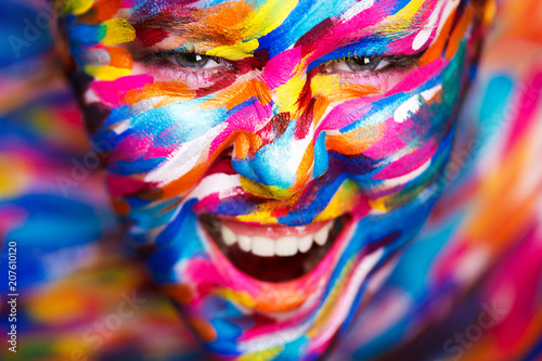Portrait of the bright beautiful girl with art colorful make-up and bodyart © Mike Orlov