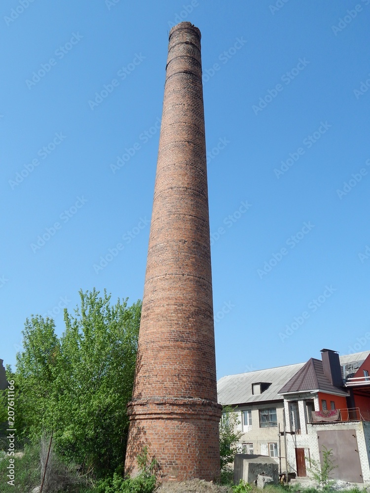 Brick factory chimney. The boiler plant. Smokestack boiler.