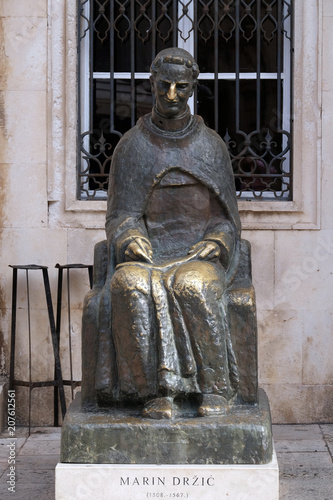 Statue of Croatian writer Marin Drzic, 1508-1567, Luza Square in the Old Town of Dubrovnik, Croatia photo