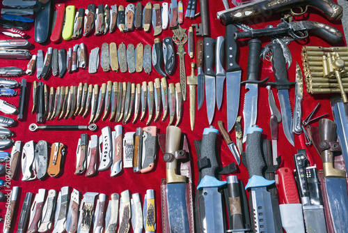 Lots of knives and cutting tools in a flea market