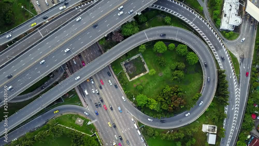 4K. Aerial view of highway road interchange with busy urban traffic speeding on the road. Junction network of transportation in Bangkok, Thailand. taken by drone 4K. Aerial view of highway road interchange with busy urban traffic speeding on the road. Junction network of transportation in Bangkok, Thailand. taken by drone